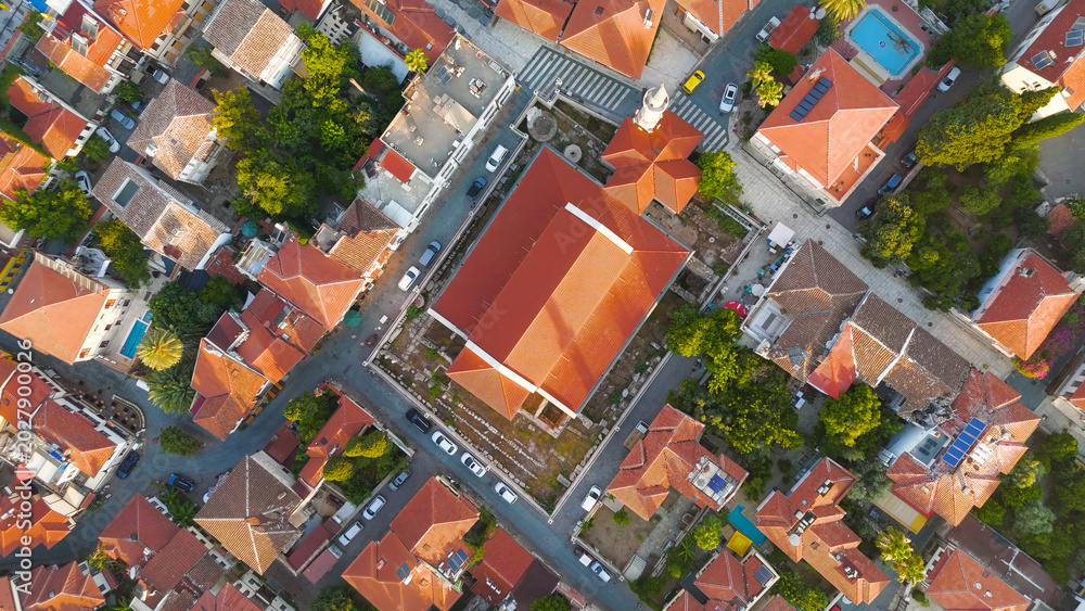 Fototapeta premium Antalya, Turkey. Aerial drone view of Kaleici Old Town streets featuring Kesik Minaret, Sehzade Korkut Mosque and ancient church in morning light.. Aerial View