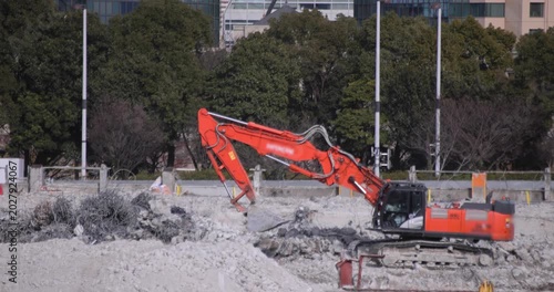 Moving cranes at the under construction in Tokyo in winter telephoto shot