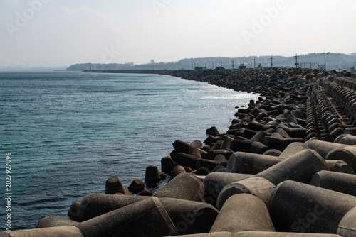 Long curved breakwater made of tetrapods at Mukho port
