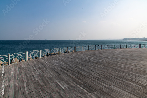 Wooden boardwalk promenade at Mukho port waterfront park in Donghae