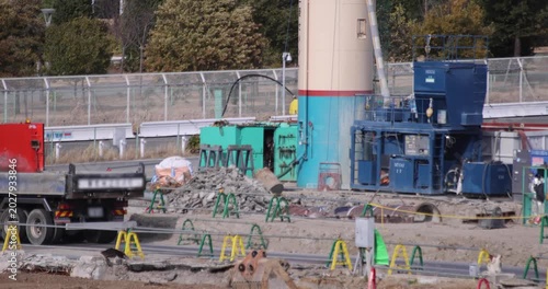 Moving cranes at the under construction in Tokyo in winter telephoto shot