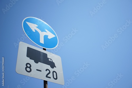 Bright blue sky above a road sign