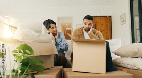 Fotografía Boxes, couple and tired with stress in new home for relocation fatigue, clutter overload or moving