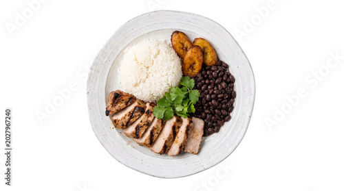Delicious Cuban dish with rice beans plantains and chicken.