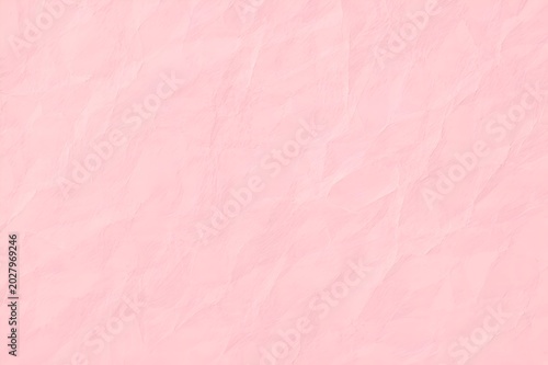Crumpled light pink paper texture background with soft wrinkles