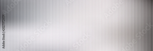 Acrylic satin corrugated glass texture light gray background. Blurred soft ribbed transparent striped door window overlay. Metal silver reeded polycarbonate sheet. Abstract vertical gradient pattern