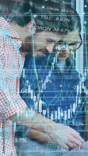 Vertical video: Two analysts tapping tablet activating market charts and percent rise analyzing ROI