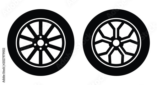 Fotografi Two car wheel silhouettes with different spoke designs on a white background sil