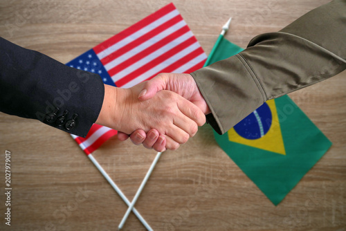 Handshake Between Brazil and USA Flags. Brazil and USA Partnership