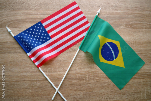USA and Brazil Flags on Table Concept. USA and Brazil Relations and Partnership