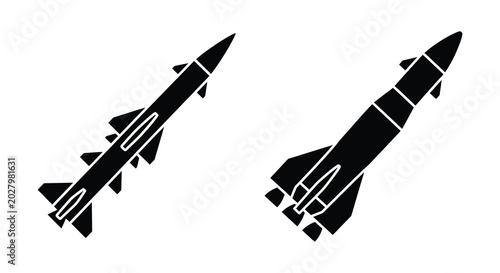 Canvas Print Two black missile silhouettes with angled wings against a white background silho