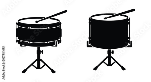 Foto Two black snare drums with drumsticks on stands isolated vector silhouette