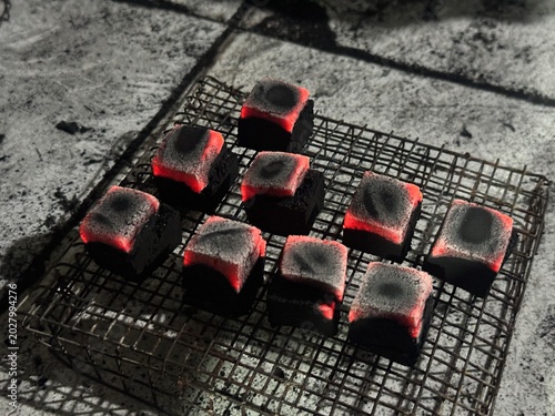 Fire burning from coconut charcoal briquette for business production	
