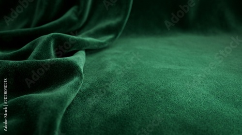 Luxurious emerald green velvet fabric draped elegantly with soft folds and highlights