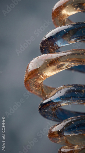 Spiral Glass Sculpture Close-Up with Blue and Amber Tones