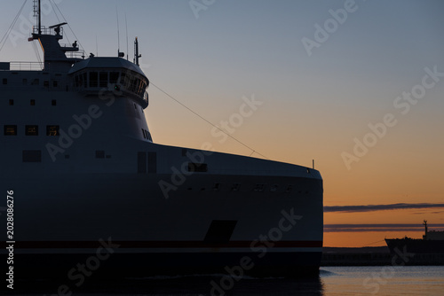 Bilde på lerret MARITIME TRANSPORT - Passenger/Car ferry sailing to the seaport on the sunrise b