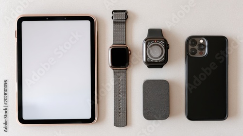 Set of modern gadgets on a beautiful dark or gray background with headphones, laptop, phone, joystick, glasses and camera