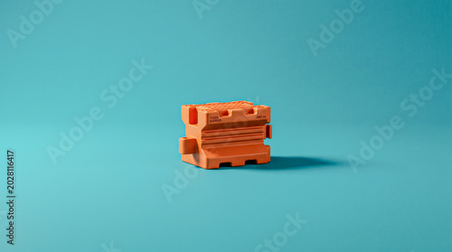 Flood barrier interlocking segment in minimalist orange design