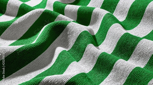 Close up of green and white striped knit terry cloth towel texture background in soft waves