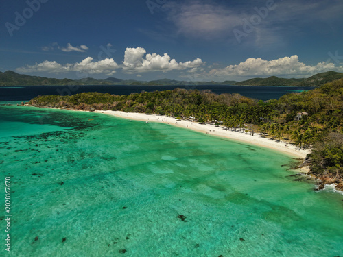 Malcapuya Island is a stunning tropical paradise in the Calamian Islands of Palawan, Philippines. Famous for its powdery, talcum-white sand and crystal-clear turquoise waters