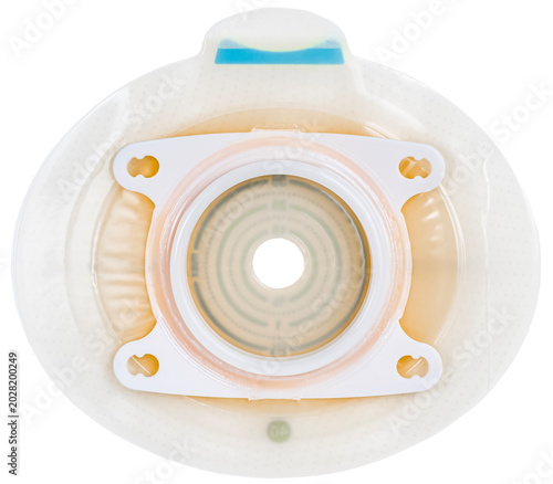 Ostomy base plate with sealed key for securing urine or stool collection bag