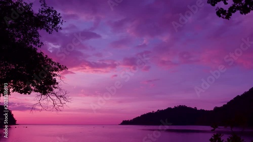 Sunset Magenta purple pink sky n red orange cloud or dramatic dark rain stom cloudscape over Sea water horizon n calm ocean wave beach, Surin island paradise, Day n night TimeLapse Phang Nga Thailand