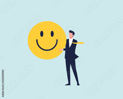 Photos Businessman holding large happy emoticon, representing positive attitude, customer satisfaction, good feedback, and successful business relationships