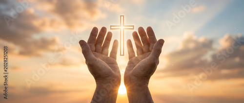 Hands Raised in Prayer with Glowing Cross Against Golden Sunrise Sky, Worship and Spirituality Concept Banner