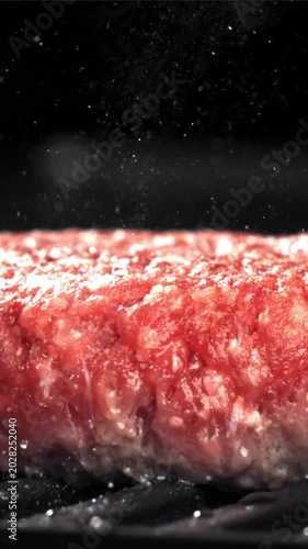 A beef burger is fried in a pan. Filmed on a high-speed camera at 1000 fps. High quality FullHD footage