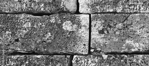 Foto Weathered Stone Wall Texture Background
