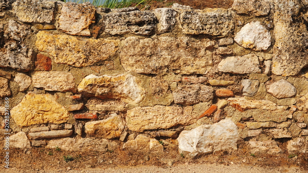 Fototapeta premium Weathered Stone Wall Texture Background