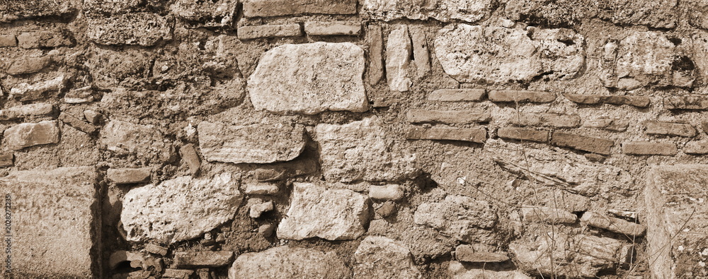 Obraz premium Weathered Stone Wall Texture Background