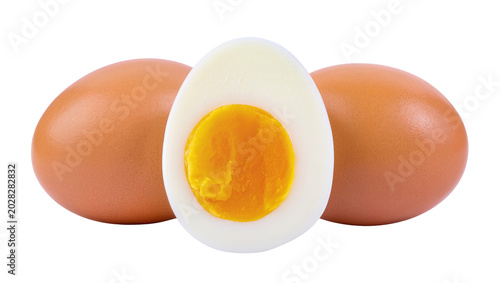 Photos Whole and halved hard-boiled eggs with bright yellow yolk