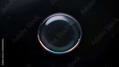 Illustrating thin film interference in a perfect spherical liquid droplet
