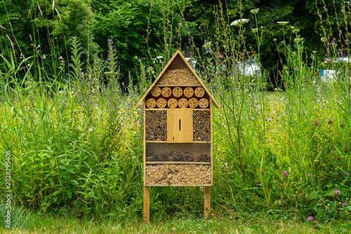 Fotografie Insect hotel in front of natural green plants in the spa park in Oberstdorf, Ger