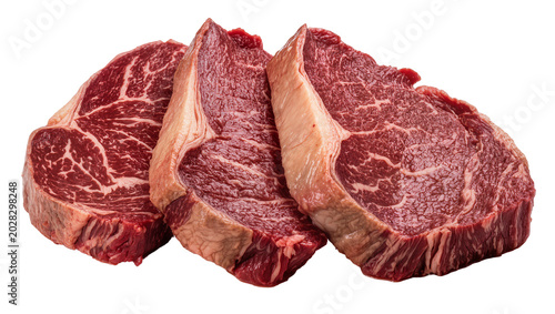 Tableau sur toile Three raw marbled beef steaks with fat