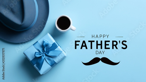 Text Happy Father's day on blue background with a gift; a tea mug or coffee cup; hat and mustache with copy space