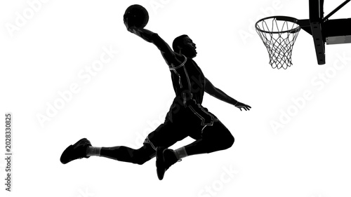 Foto basketball player silhouette dunking with ball against a white background