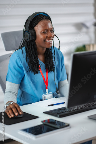 Female nurse providing telehealth medical consulting services online
