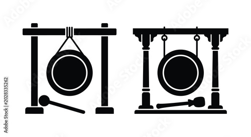 Fotografía Traditional korean percussion instrument kkwaenggwari with mallet black silhouet
