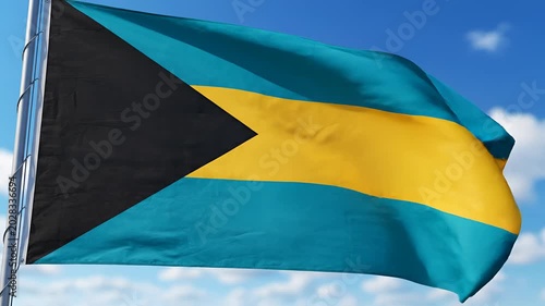 The National Flag of The Bahamas Waving Proudly in the Blue Sky.