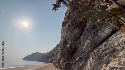Rocky cliff coast with bright sunny sky