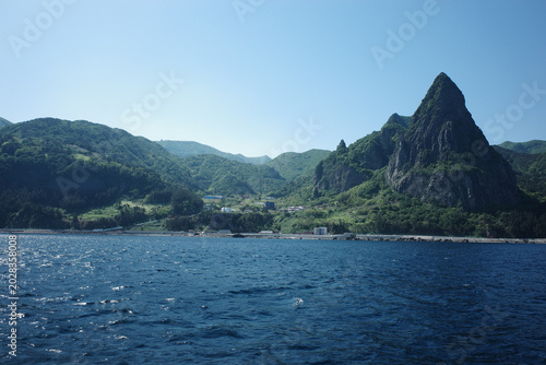 Coastal landscape with prominent mountain peak