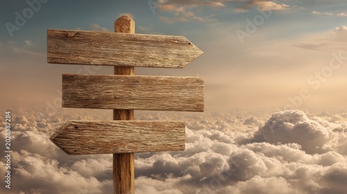 Wooden signpost stands above the clouds against a soft sunset sky.