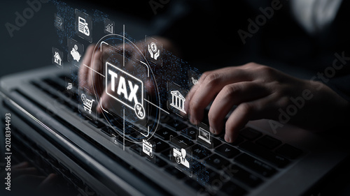 Tableau sur toile Hands Typing on Laptop with Tax Icons Overlay on Screen, Representation of Finan