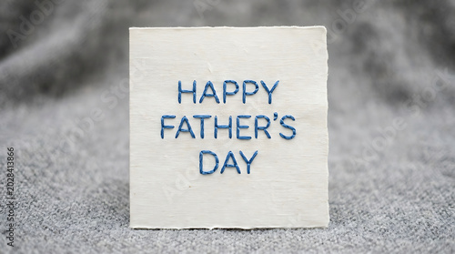 Meaningful 'Happy Father's Day' message displayed on a soft textile surface