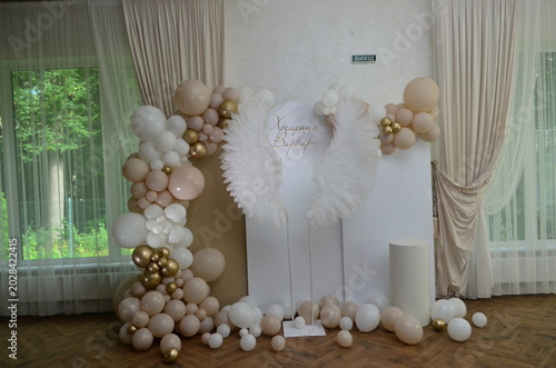 Obraz na plátne Children's photo zone with wings for a child's baptism
