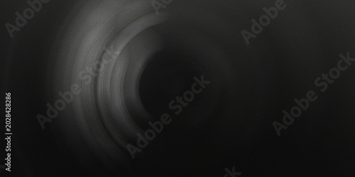 Bild auf Leinwand Monochrome circular motion blur background with dark grey tones and concentric rings for professional tech or industrial designs