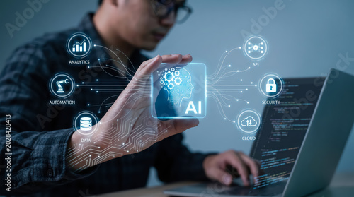 A developer working on a laptop with a futuristic ai interface hologram showing data, automation, and security