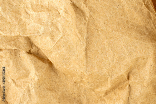 Crumpled piece of kraft paper, macro, top view.